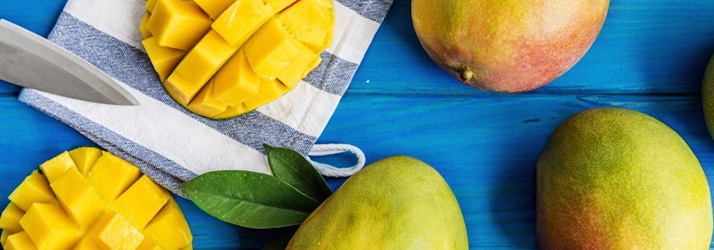 mangoes on blue table mangoes on blue table